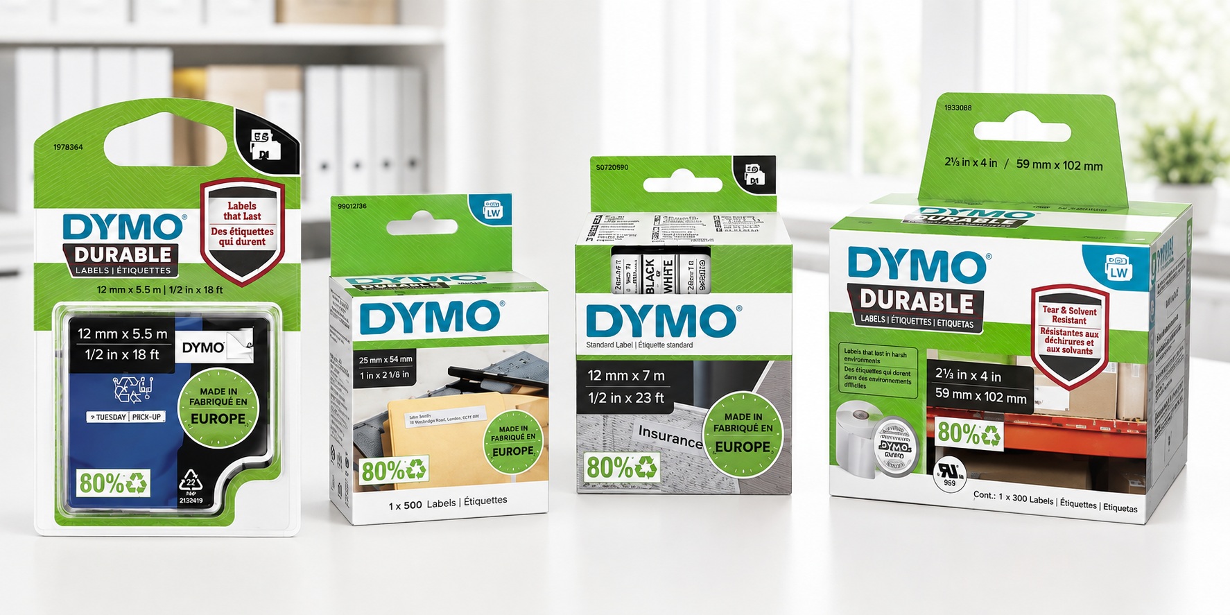 DYMO LabelWriter labels, LetraTag refills and embossing tapes arranged on a bright modern office desk.