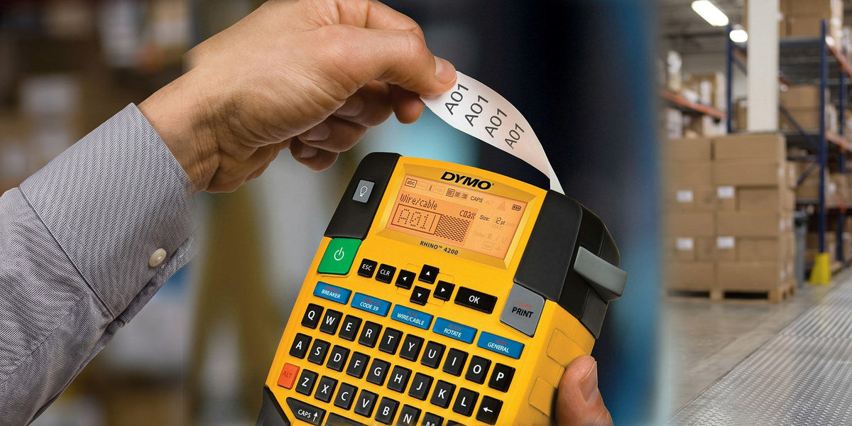 DYMO RHINO 4200 industrial label maker printing cable ID labels in a warehouse
