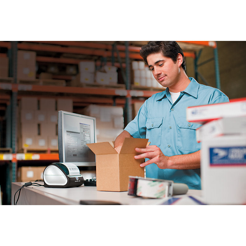 Busy packing station using Dymo shipping labels for parcel dispatch