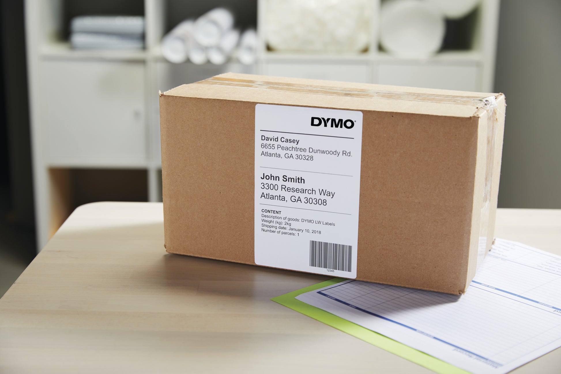 Brown parcel with white shipping label on top