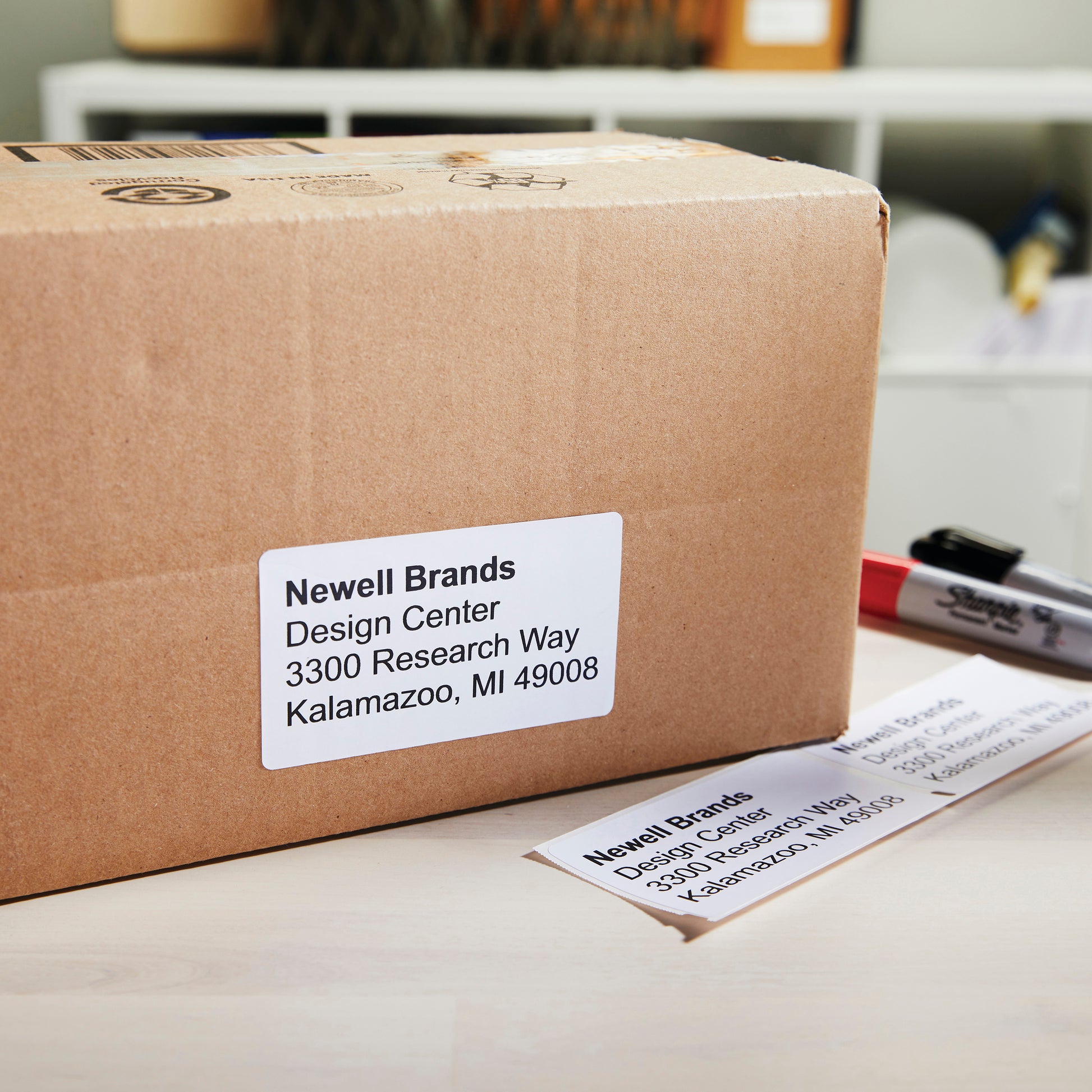 Cardboard parcel with printed shipping label attached