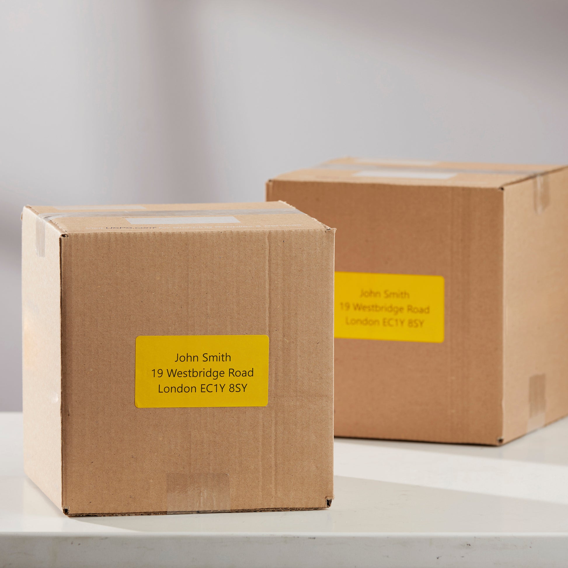 Storage containers with yellow identification labels attached