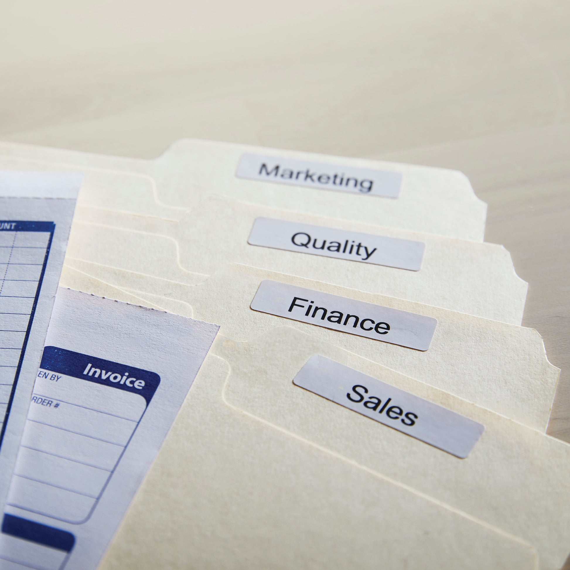 Stack of labelled file folders or document sleeves