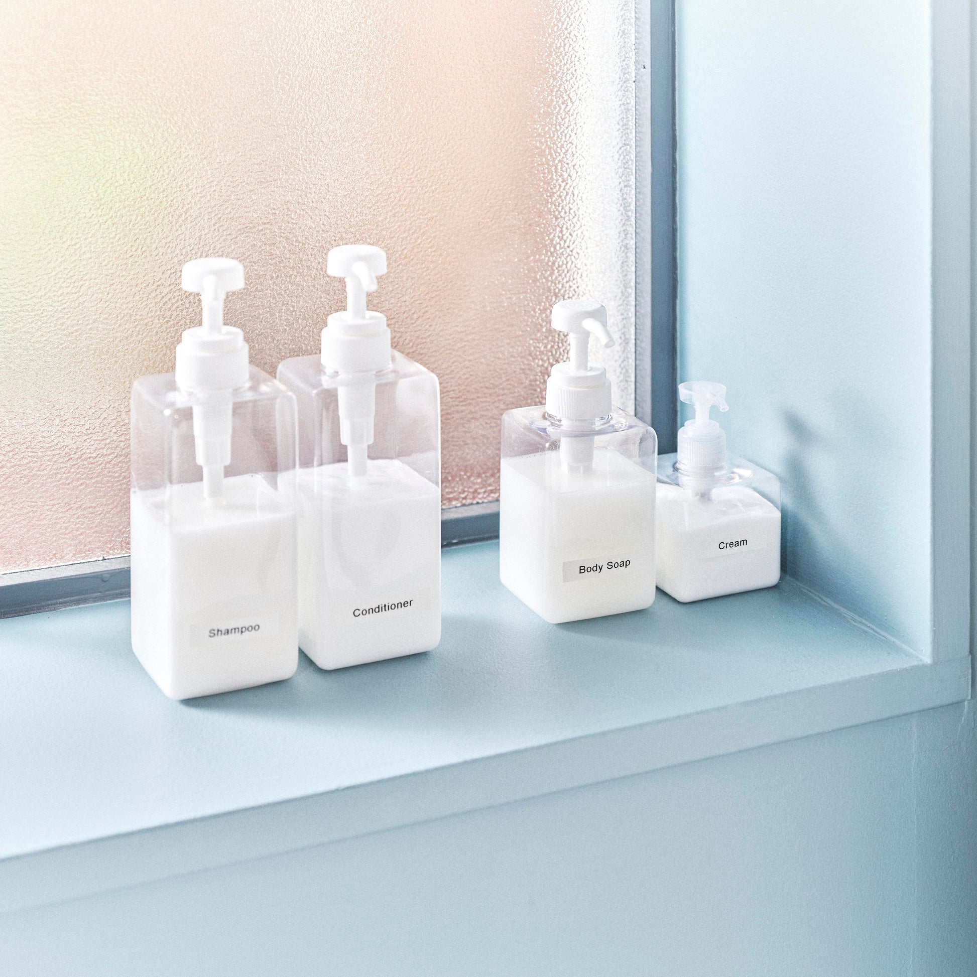 Minimal desktop display with labelled bottles and containers