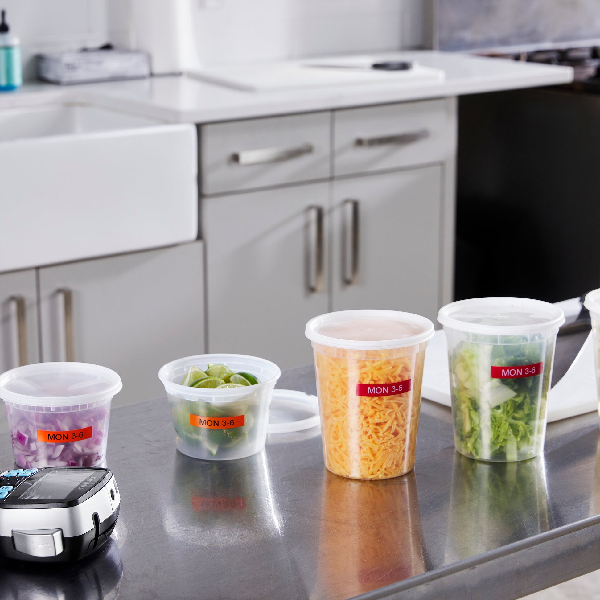 Labelled spice jars and kitchen containers on a countertop