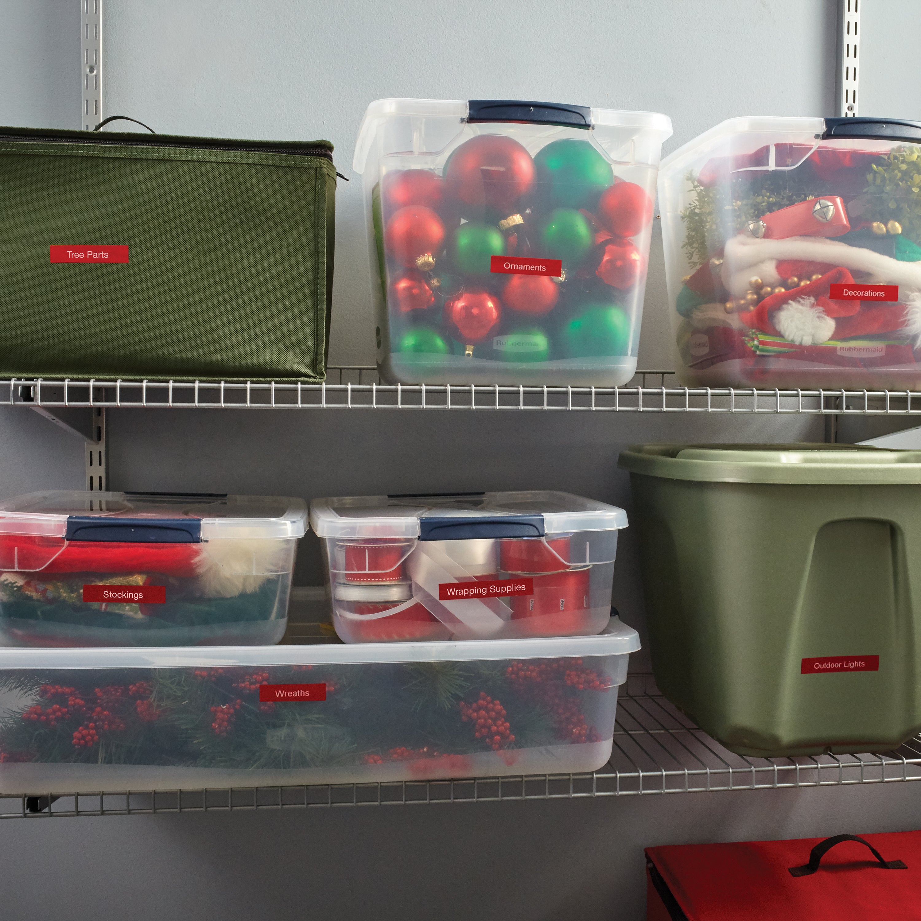Shelving unit organised with labelled storage tubs for Christmas decorations, wreaths, stockings and wrapping supplies