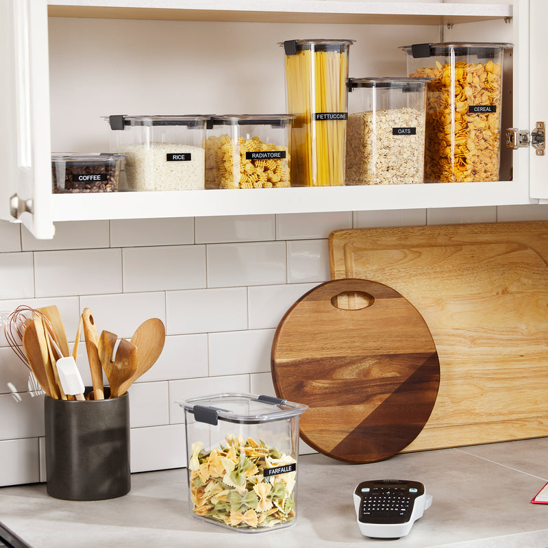 Labelled kitchen containers and pantry jars on open shelving