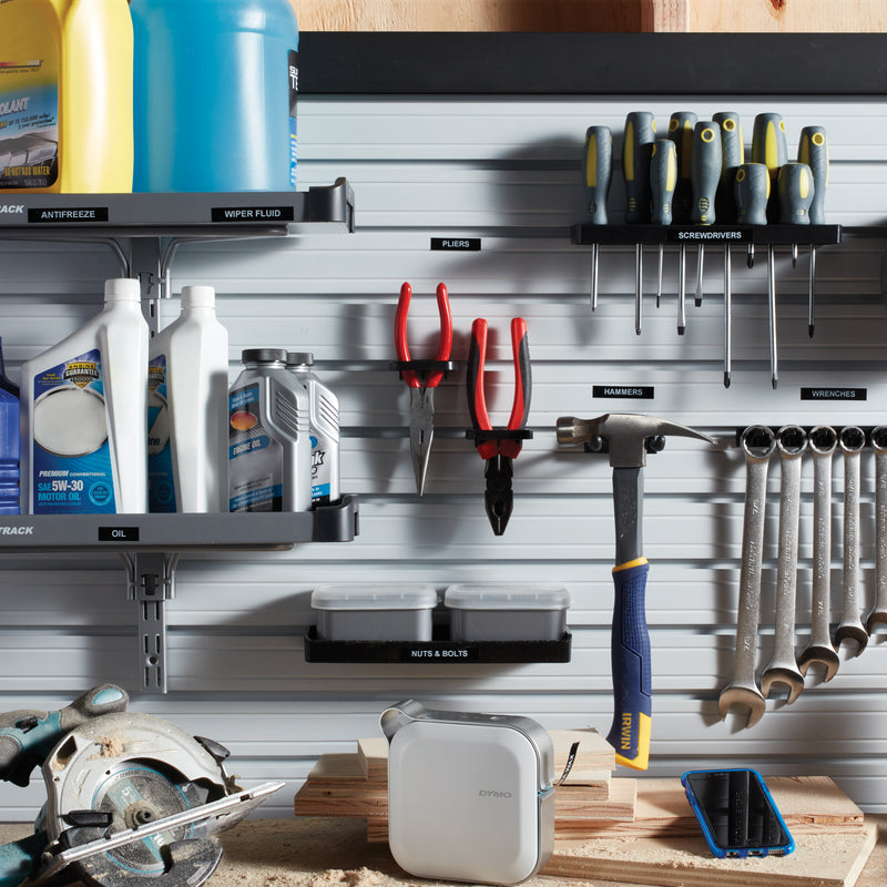 Organised workshop wall with labelled tools and storage containers
