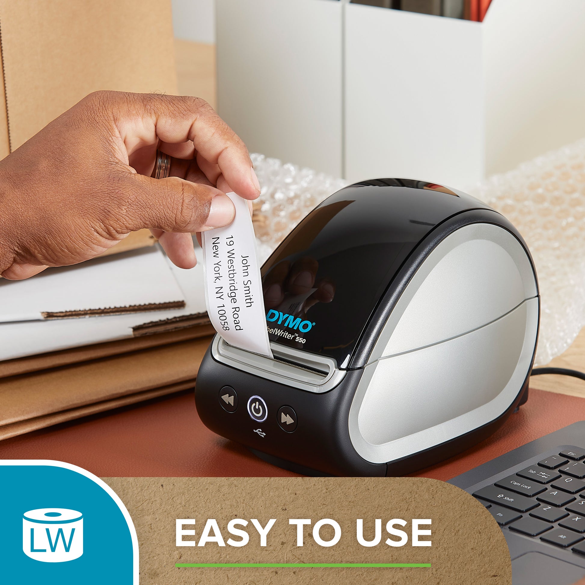 Hands using a Dymo LabelWriter printer to print a label