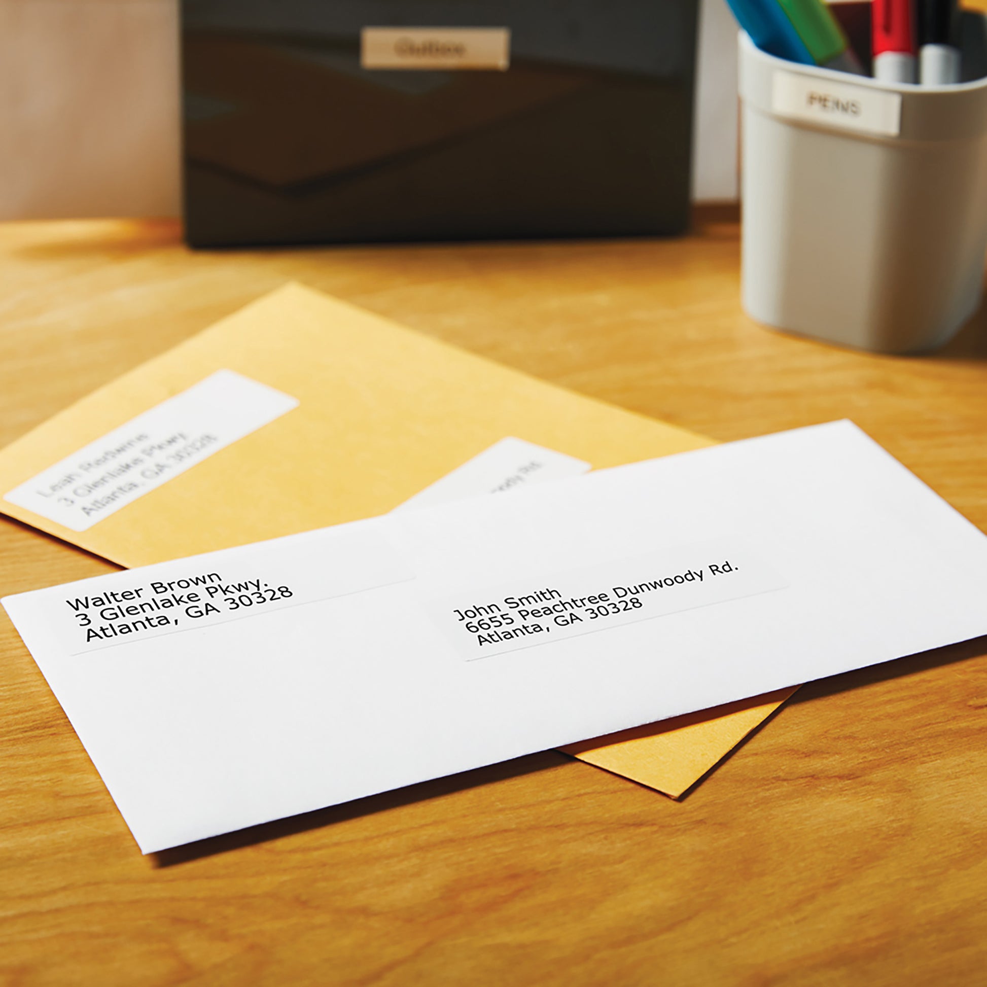 Large white address label placed on a padded mailer envelope