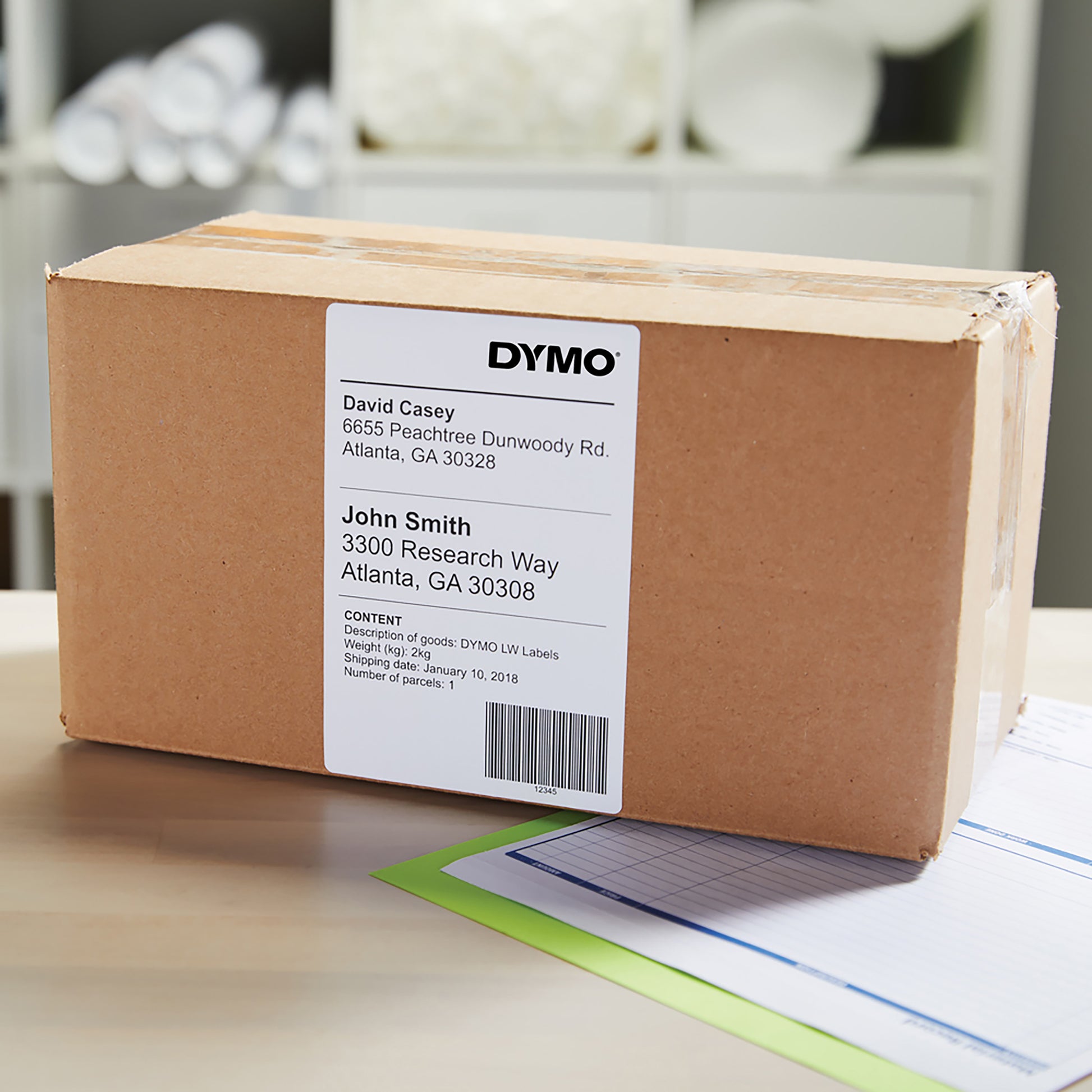 Brown parcel with white shipping label on top