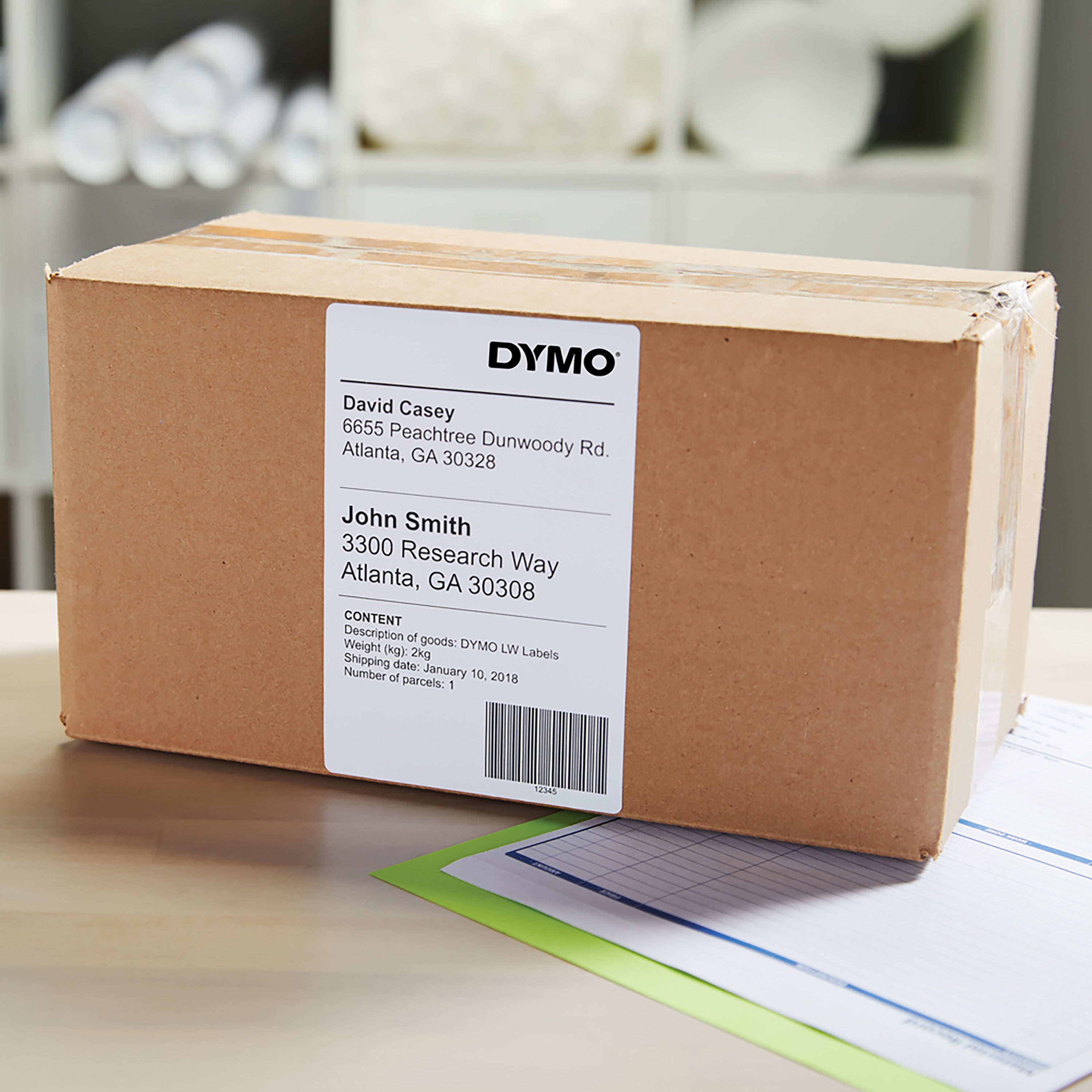 Brown parcel with white shipping label on top