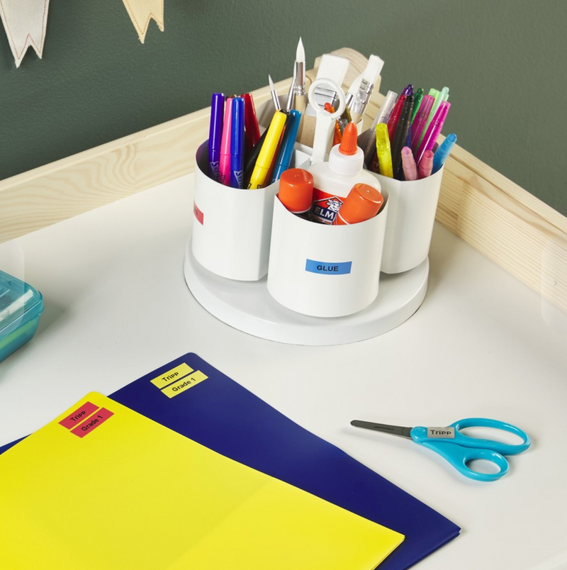 DYMO LetraTag LT100H Handheld Label Maker in use with school supplies and stationery