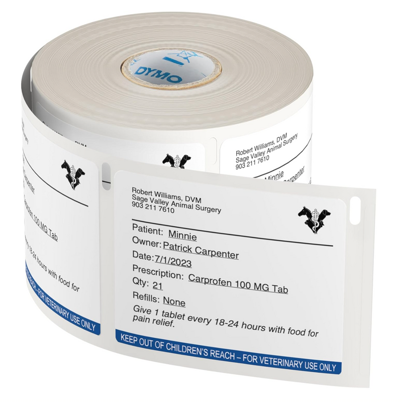 A roll of Dymo pre-printed veterinary labels featuring clear, detailed patient information and a bold "For Veterinary Use Only" caution strip.
