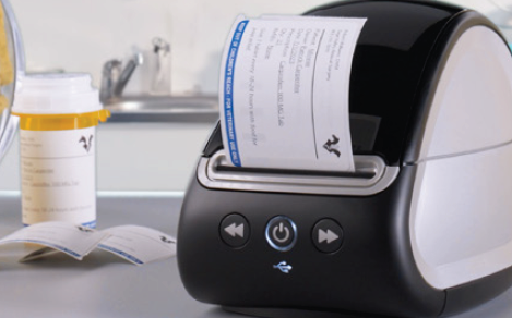 DYMO LabelWriter printing veterinary drug prescription labels with clear and detailed information, designed for use in veterinary practices. The printer outputs professional labels ideal for medication bottles, featuring a veterinary logo and prescription details.