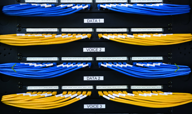 DYMO Rhino white on black 24mm laminated labels used on multiple blue and yellow wires