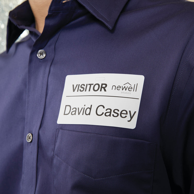 Visitor name badge printed on a 54 x 101mm Dymo label worn on a shirt