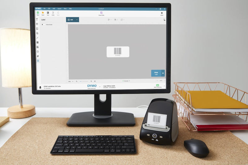 Modern office desk setup with DYMO 550T Turbo connected via LAN for shared label printing